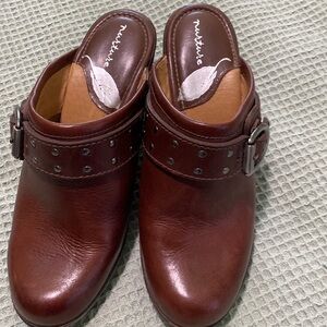 Nurture woman’s  leather clogs with decorative buckle